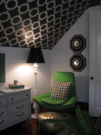 Green chair, wallpapered ceiling