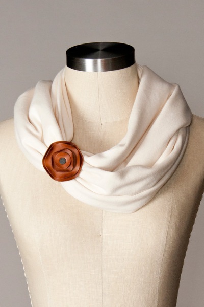 Cute and cozy! This soft cotton infinity scarf is accented with removable leather rosette, $50. See other color cobinations and prints at flytrap, of North Carolina.