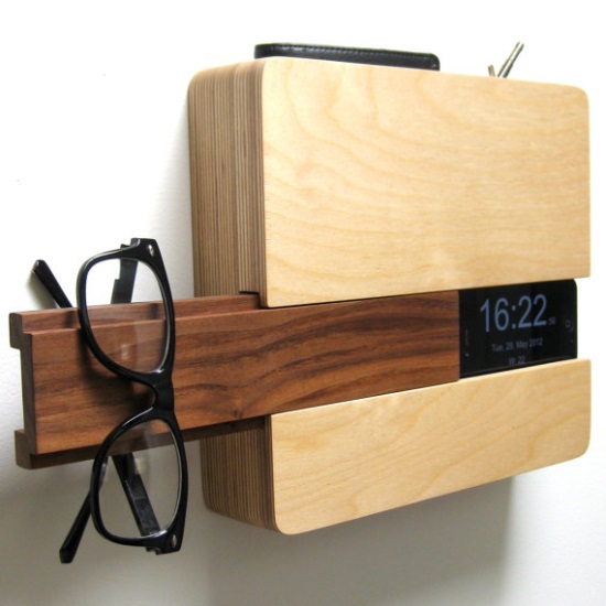 This multi-tasker organizes phone, keys and glasses whitrle tracking the time. Perfect for an entrance. office or dressing area. $119 from micklish of California.